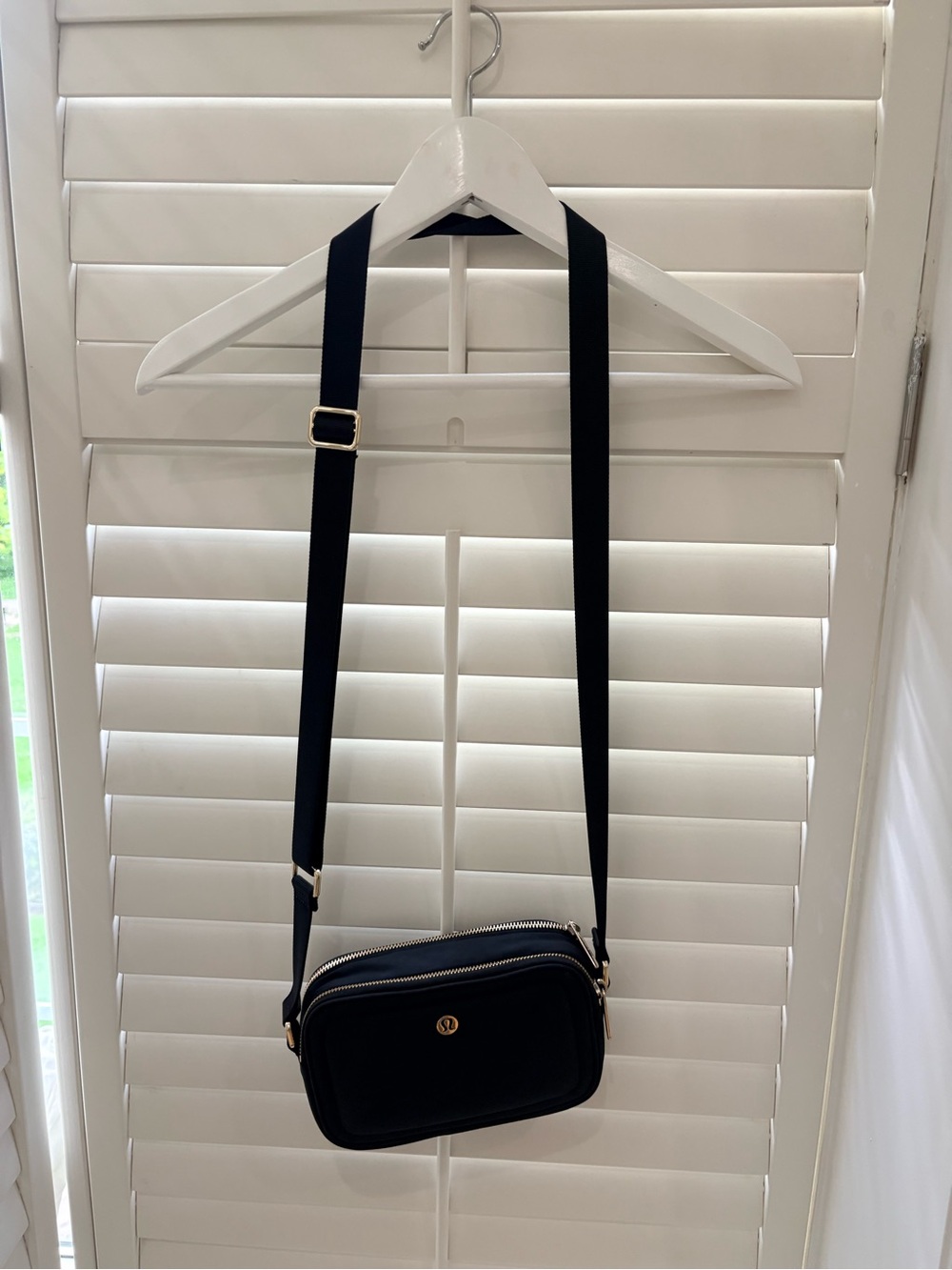 Black LULULEMON Crossbody 2L Bag with Gold Accent